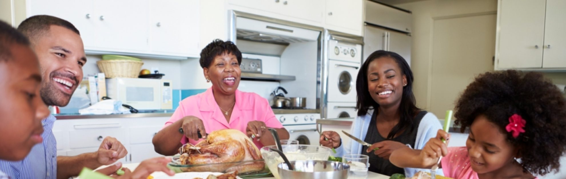 Family eating a meal around a table